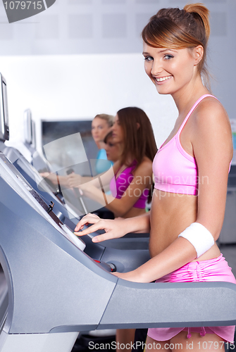 Image of fit lady working out in gym