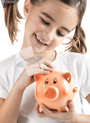 Image of Little girl with a piggy-bank