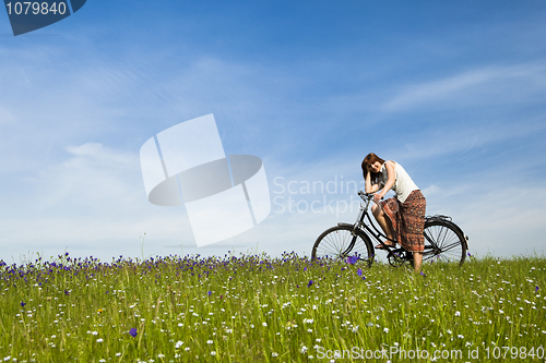 Image of Girl with a bicycle
