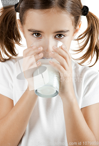 Image of Little girl drinking milk