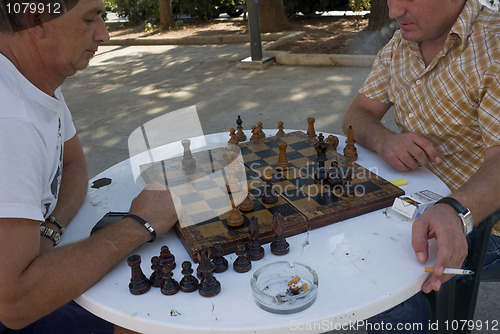 Image of Men playing chess