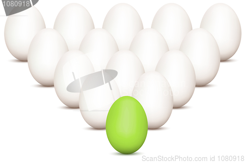 Image of group of eggs with unique green egg