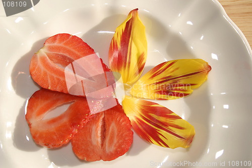 Image of strawberry slices and petals