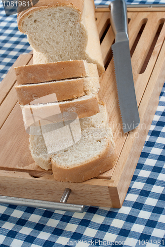 Image of Slices of bread on top of wooden board