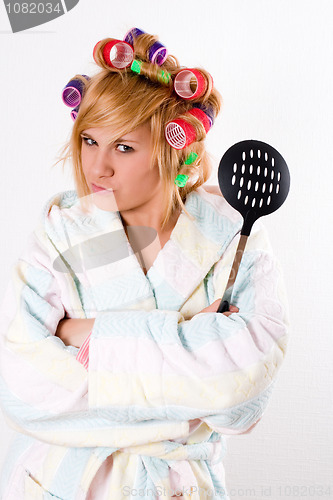 Image of housewife with curlers and skimmer