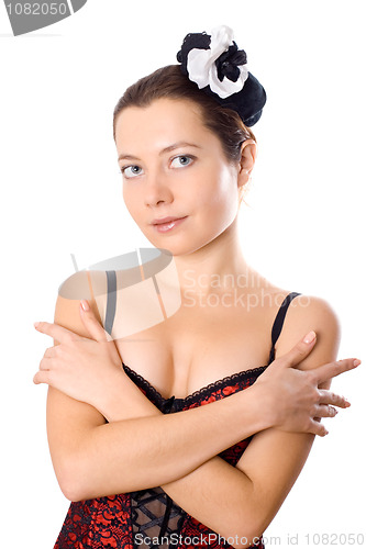 Image of attractive woman in corset and little hat 