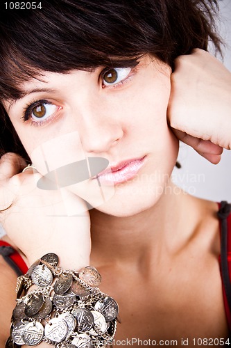 Image of brunette lady with bracelets