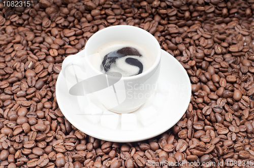 Image of Slabs of shugar and cup of coffee