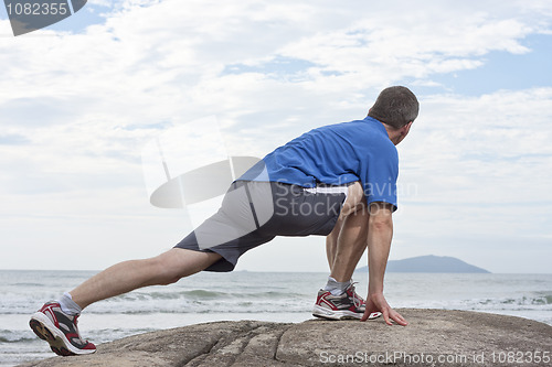 Image of Runner doing stretching exercise