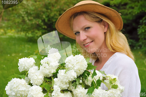 Image of Young woman with snowballs