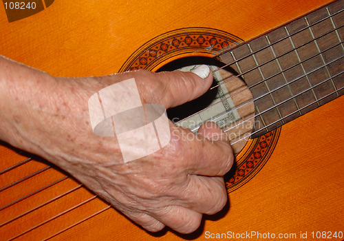 Image of ancient playing the guitar