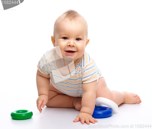 Image of Little boy play with toys