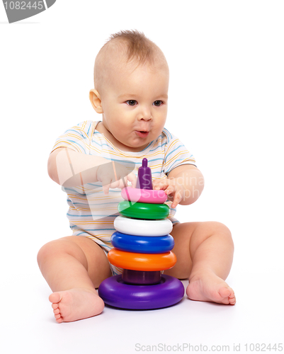 Image of Little boy play with toys