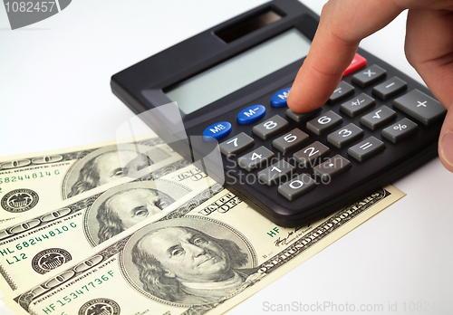 Image of Calculator and money - accounting concept