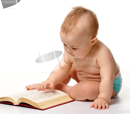 Image of Little child play with book