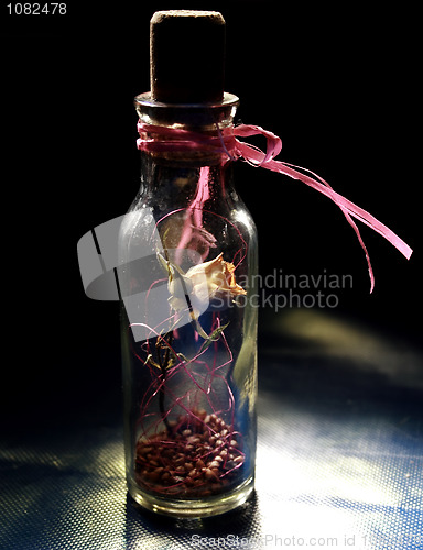 Image of dried yellow rose in the bottle