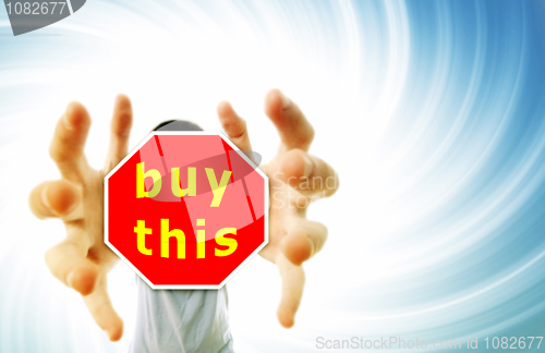 Image of Man grabing a red sign.