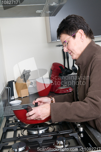 Image of Senior woman cooking