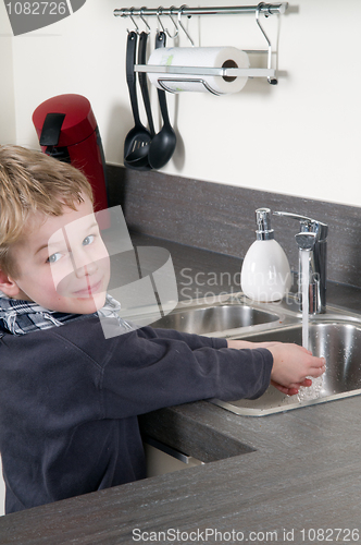 Image of Child washing his hands