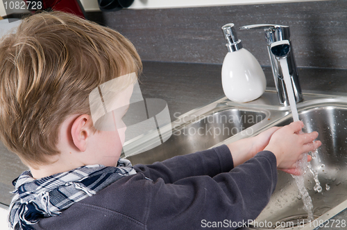 Image of Child washing his hands