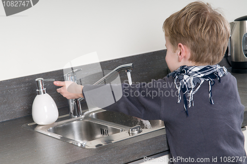 Image of Child washing his hands