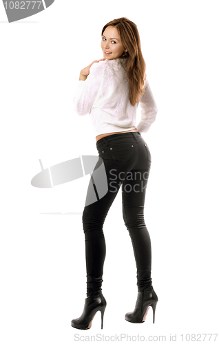 Image of Playful beautiful girl in black tight jeans