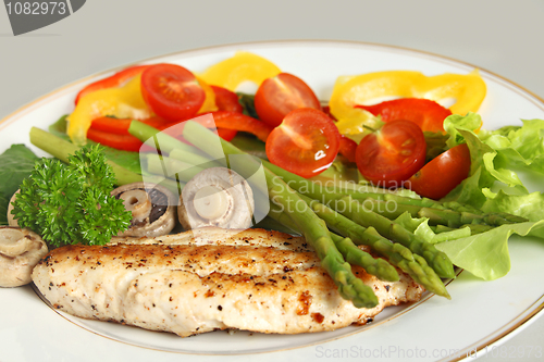 Image of Fried fish, asparagus and salad