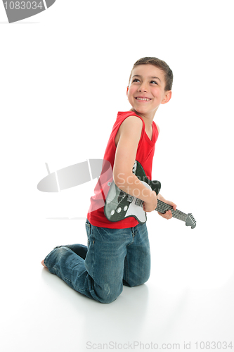 Image of Little boy playing guitar