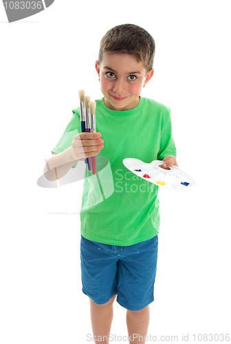 Image of Young boy artist holding paints and brushes