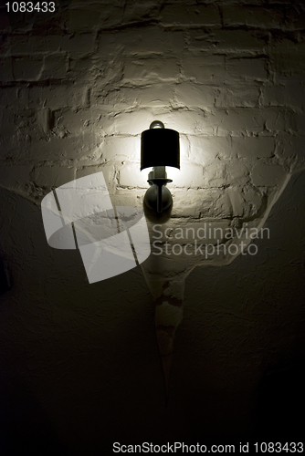 Image of Photo of wall lamp with dim light   