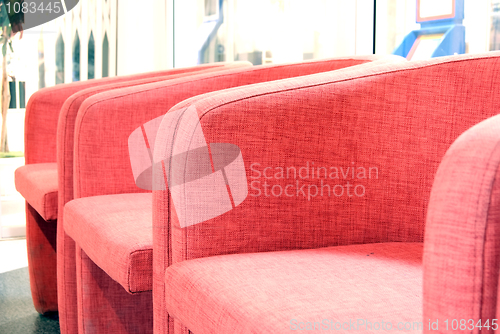 Image of red armchairs