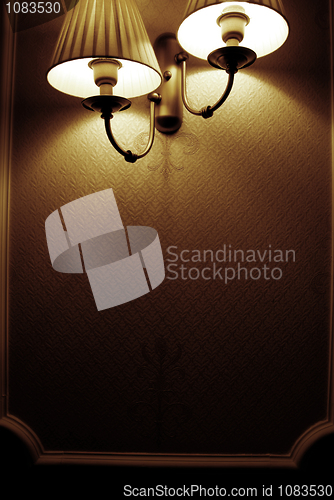 Image of Photo of wall lamp with dim light