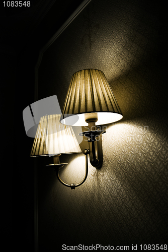 Image of Photo of wall lamp with dim light   