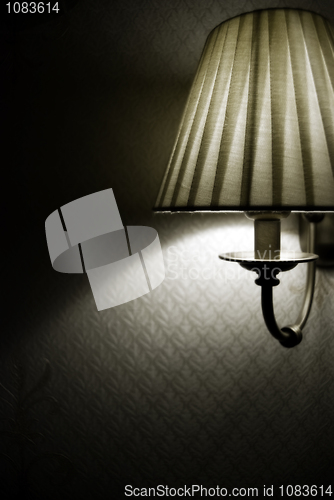 Image of Photo of wall lamp with dim light  