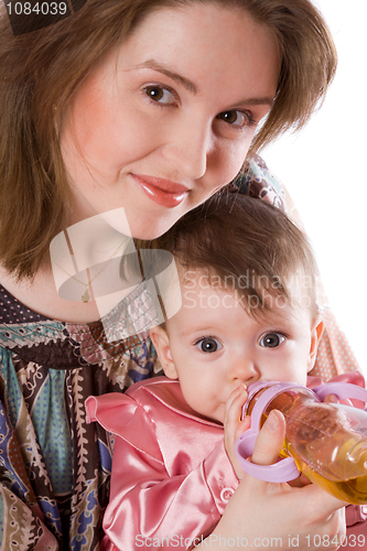 Image of Mother feeding baby