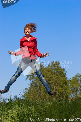 Image of Young woman jumping