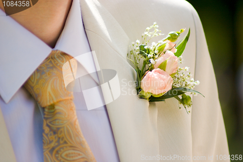 Image of buttonhole with tea-rose