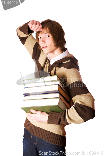 Image of Young man holding books