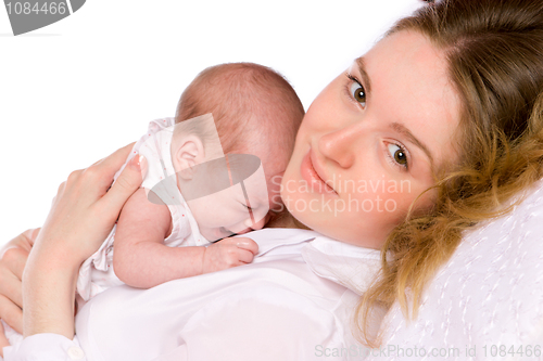 Image of mother holding crying  baby