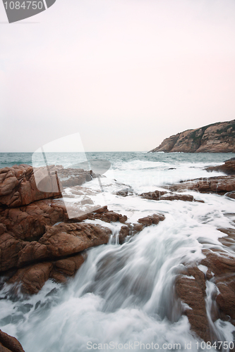 Image of Beautiful seascape. Sea and rock at the sunset. Nature compositi