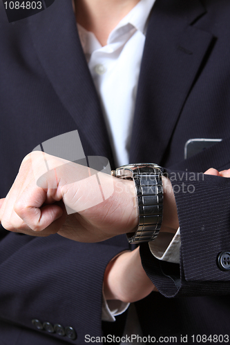 Image of men's hand with a watch.