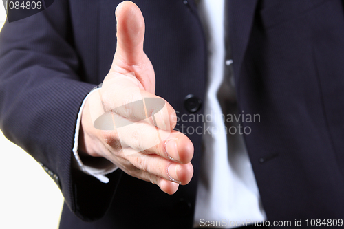 Image of business man with an open hand ready to seal a deal 