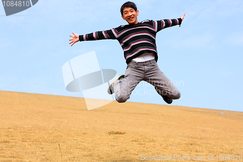 Image of Happy jumping man on winter day 