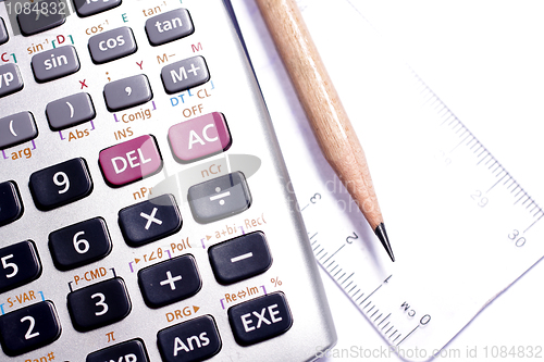 Image of close-up of ruler,calculator,and pencil,focus on pencil-tip