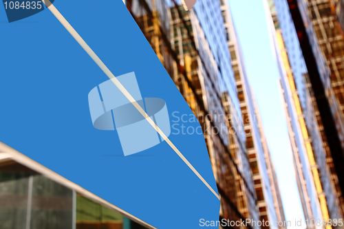 Image of Concept image of a signpost against a modern glass office buildi
