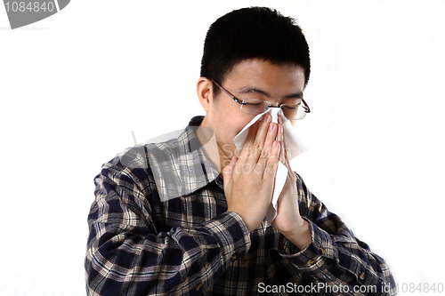 Image of man blowing his nose 