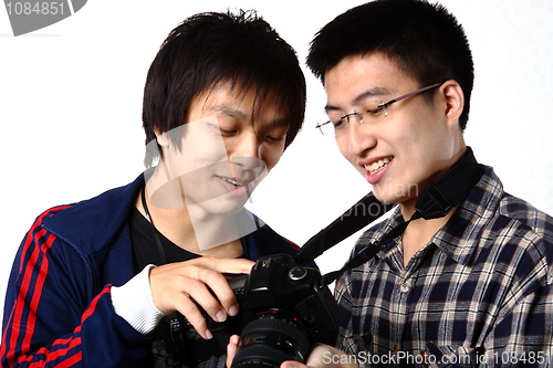 Image of two man watching the camera