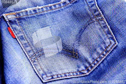 Image of Fragment of blue modern jeans with pocket, can be used as a back