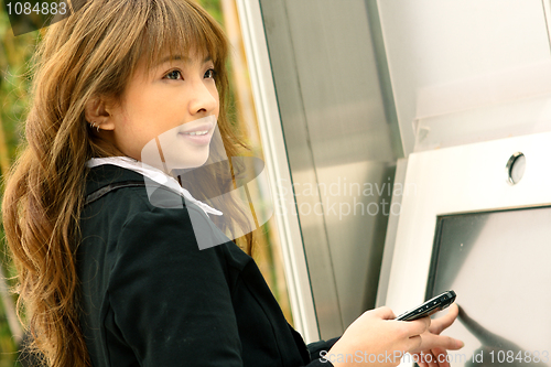 Image of business woman play the touch screen 