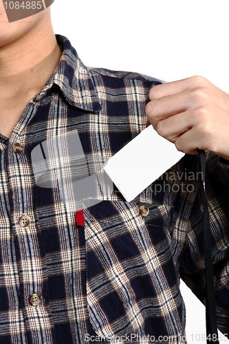 Image of Man putting a blank card into his pocket 